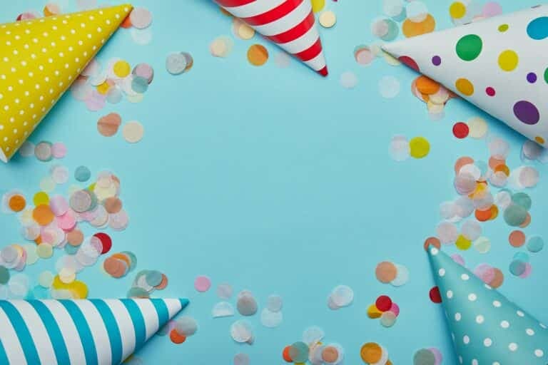 a group of party hats and confetti